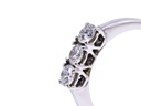 Anello modello trilogi in oro bianco a titolo750/°°° di grammi2.60 con tre diamanti naturali di carati 0.15 cad.