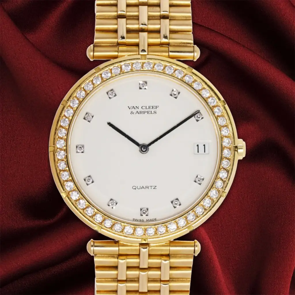 Van Cleef & Arpels, 18kt Yellow Gold, 34 mm, Quartz, Natural Diamonds Bezel and Dial, total weight 118 gr. Our Box & warranty