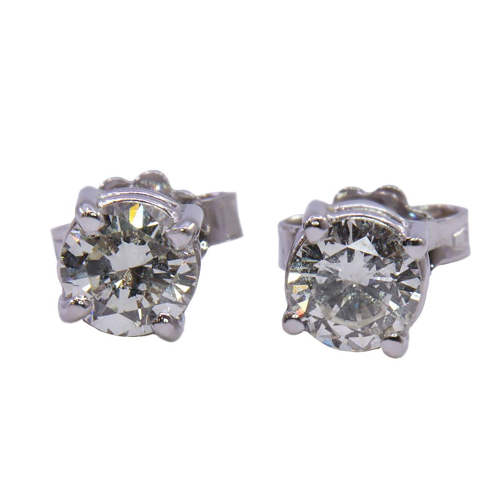 Orecchini mod. punto luce in oro bianco (18 kt)con due diamanti(0.34+0.37)