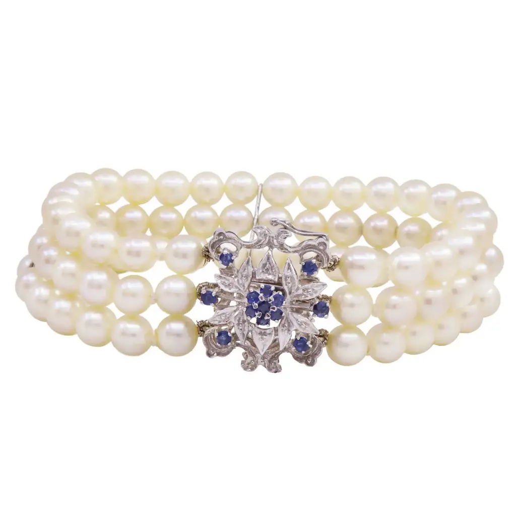 Bracciale con perle giapponesi - Susta in oro 18kt con brillanti e zaffiri blu, peso totale 34,40gr.